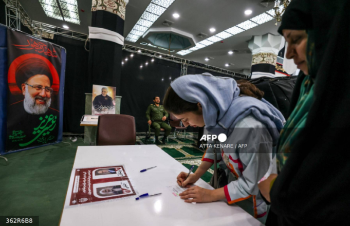 Iranian-women-prepare-to-cast-their-ballots-at-a-polling-station-in-Tehran-on-July-5-2024